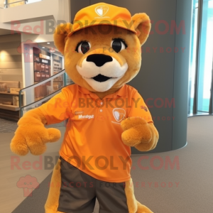 Orange Mountain Lion mascot costume character dressed with a Shorts and Caps