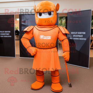 Orange Spartan Soldier mascot costume character dressed with a Polo Tee and Tie pins