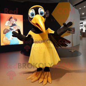 Gold Toucan mascot costume character dressed with a A-Line Dress and Belts