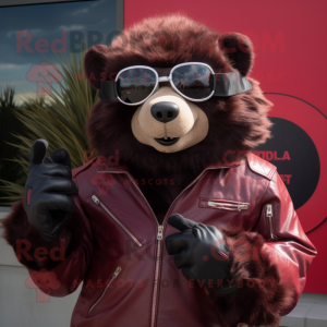 Maroon Sloth Bear mascot costume character dressed with a Moto Jacket and Sunglasses