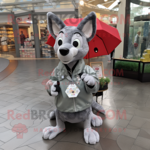Gray Dingo mascot costume character dressed with a Raincoat and Coin purses
