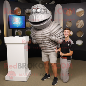 Silver Trilobite mascot costume character dressed with a Henley Shirt and Watches