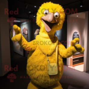 Yellow Ostrich mascot costume character dressed with a Turtleneck and Clutch bags