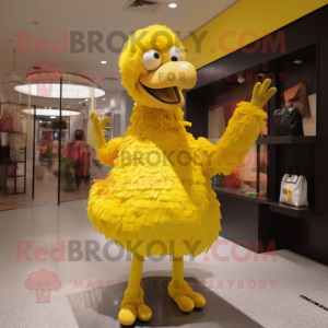 Yellow Ostrich mascot costume character dressed with a Turtleneck and Clutch bags