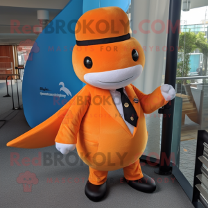 Orange Narwhal mascot costume character dressed with a Dress Pants and Hat pins