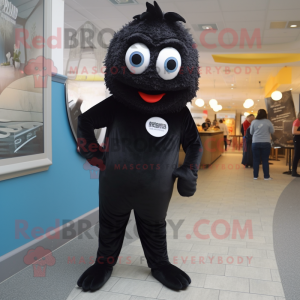 Black Fish And Chips mascot costume character dressed with a Jeggings and Brooches