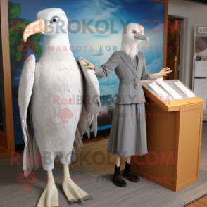 Silver Albatross mascot costume character dressed with a Sheath Dress and Ties