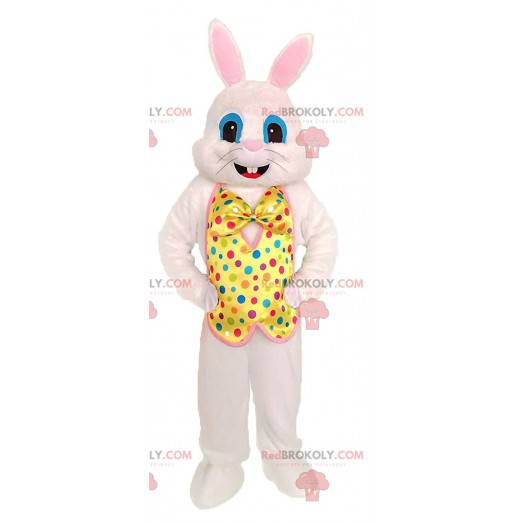 White rabbit mascot with a yellow vest with colored dots -