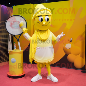 Yellow Tennis Racket mascot costume character dressed with a Yoga Pants and Shawl pins
