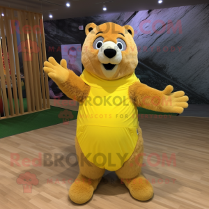 Yellow Marmot mascot costume character dressed with a Wrap Skirt and Foot pads