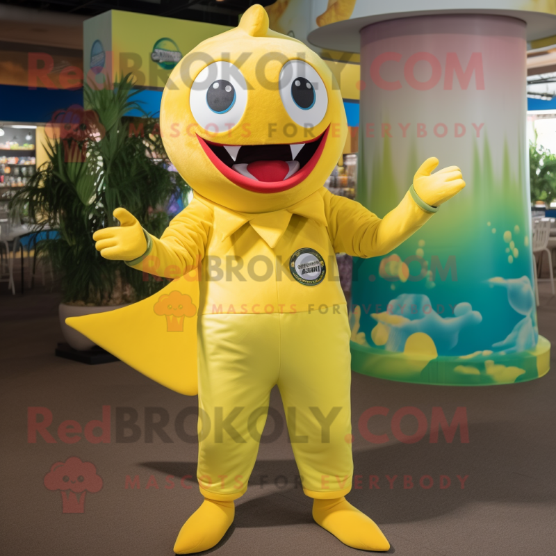 Yellow Tuna mascot costume character dressed with a Jumpsuit and Belts