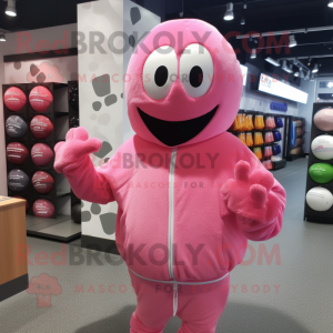 Pink Golf Ball mascot costume character dressed with a Hoodie and Headbands