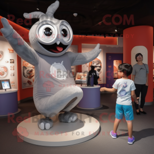 Gray Contortionist mascot costume character dressed with a Long Sleeve Tee and Watches