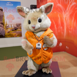 Orange Chinchilla mascot costume character dressed with a Henley Shirt and Shawl pins