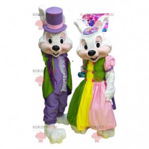 Mascotte couple de lapins blancs en tenue de soirée colorée. -