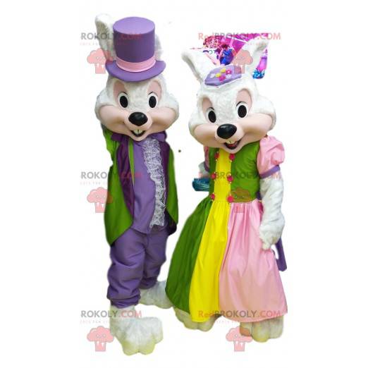 Mascot couple of white rabbits in colorful evening dress. -