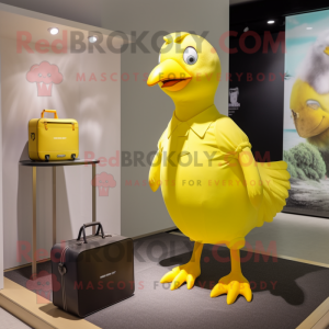 Yellow Pigeon mascot costume character dressed with a Tank Top and Handbags