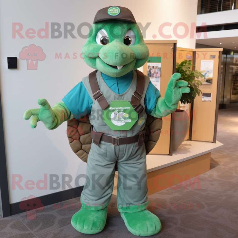 Forest Green Sea Turtle mascot costume character dressed with a Overalls and Keychains Forest Green Sea Turtle mascot costume character dressed with a Overalls and Keychains