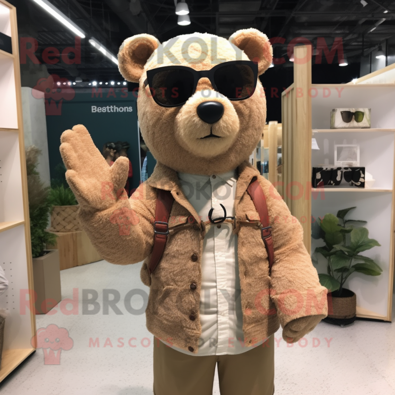 Beige Bear mascot costume character dressed with a Cardigan and Sunglasses Beige Bear mascot costume character dressed with a Cardigan and Sunglasses