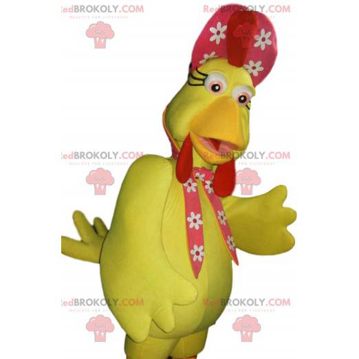 Mascotte de poule jaune et son chapeau rouge à fleurs -