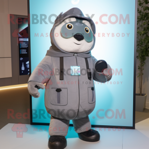 Gray But mascot costume character dressed with a Parka and Smartwatches