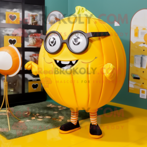 Yellow Pumpkin mascot costume character dressed with a Swimwear and Reading glasses