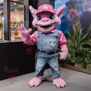 Pink Gargoyle mascot costume character dressed with a Denim Shorts and Hat pins