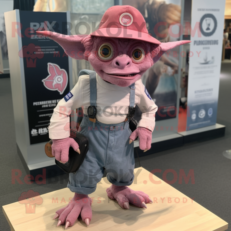 Pink Gargoyle mascot costume character dressed with a Denim Shorts and Hat pins