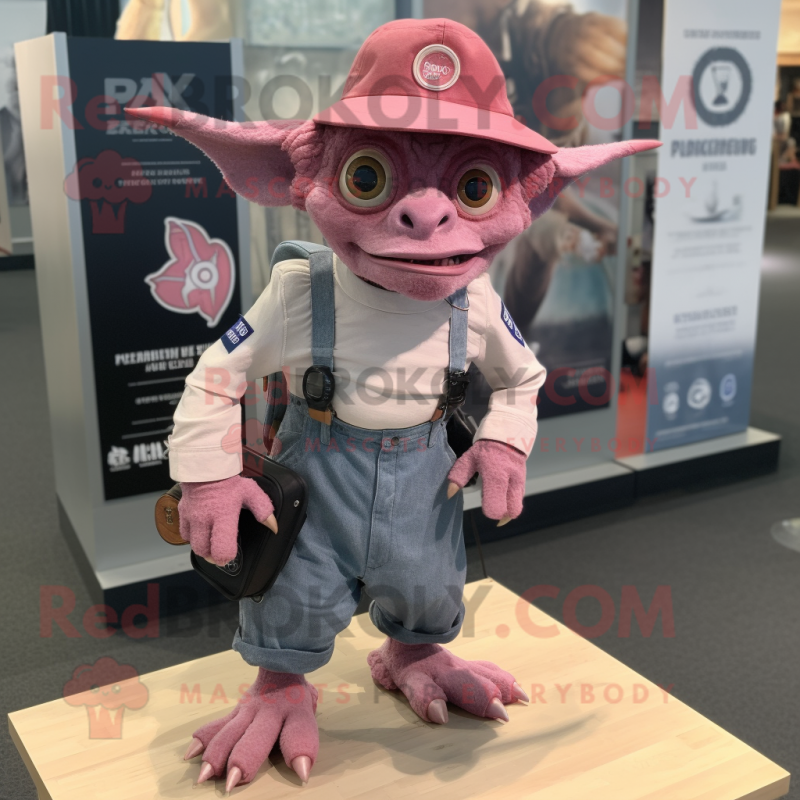 Pink Gargoyle mascot costume character dressed with a Denim Shorts and Hat pins Pink Gargoyle mascot costume character dressed with a Denim Shorts and Hat pins