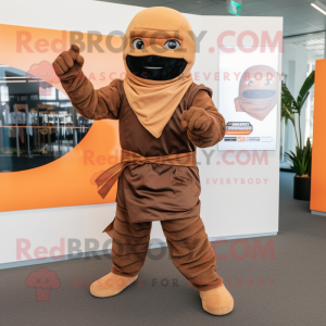 Brown Ninja mascot costume character dressed with a Playsuit and Scarves