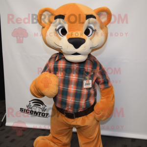 Orange Mountain Lion mascot costume character dressed with a Flannel Shirt and Pocket squares