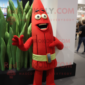 Red Asparagus mascot costume character dressed with a Graphic Tee and Belts