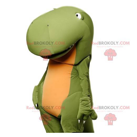 Mascote de dinossauro verde super engraçado com seu nariz