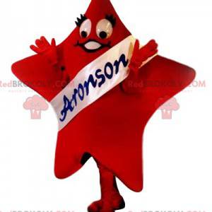 Mascotte d'étoile rouge avec son écharpe blanche Aronson -