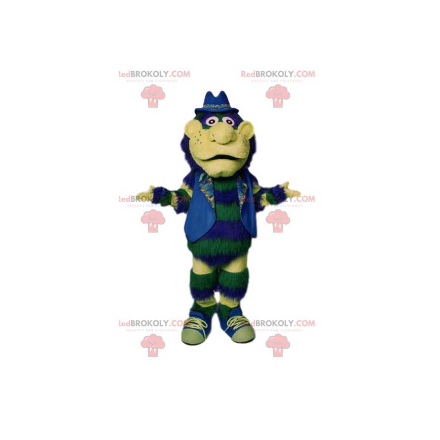 Green snowman mascot with his jacket and blue hat -