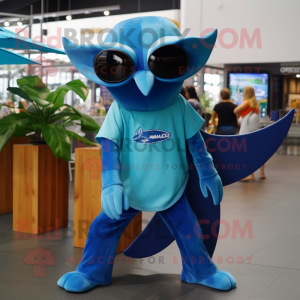 Blue Manta Ray mascot costume character dressed with a Henley Tee and Sunglasses