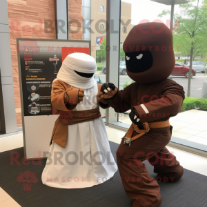 Brown Ninja mascot costume character dressed with a Wedding Dress and Watches