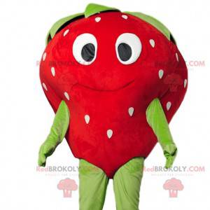 Strawberry mascot flirtatious with a beautiful smile -