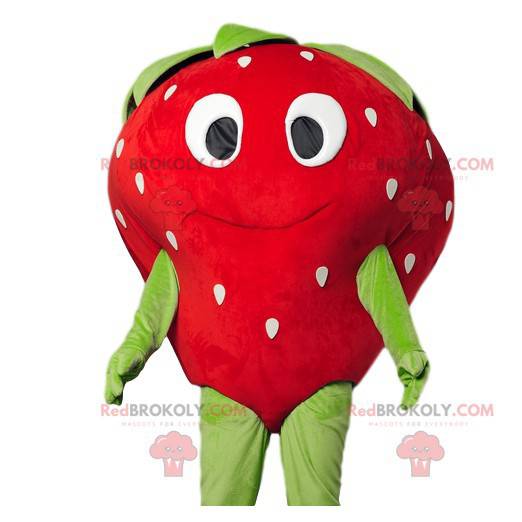 Strawberry maskot flirtig med ett vackert leende -