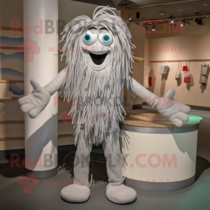 Silver Spaghetti mascot costume character dressed with a Bermuda Shorts and Mittens