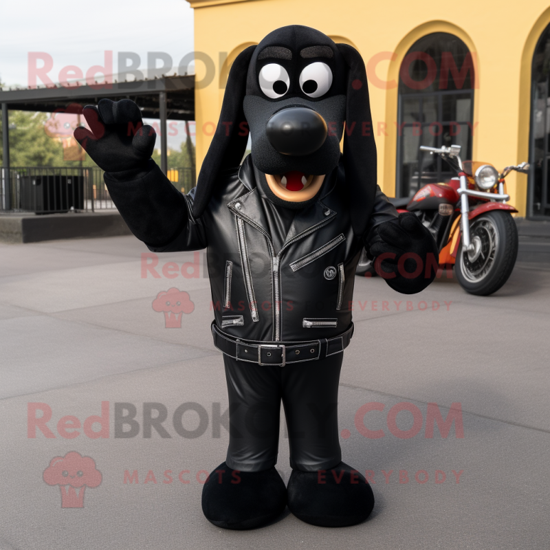 Black Hot Dogs mascot costume character dressed with a Biker Jacket and Tie pins Black Hot Dogs mascot costume character dressed with a Biker Jacket and Tie pins