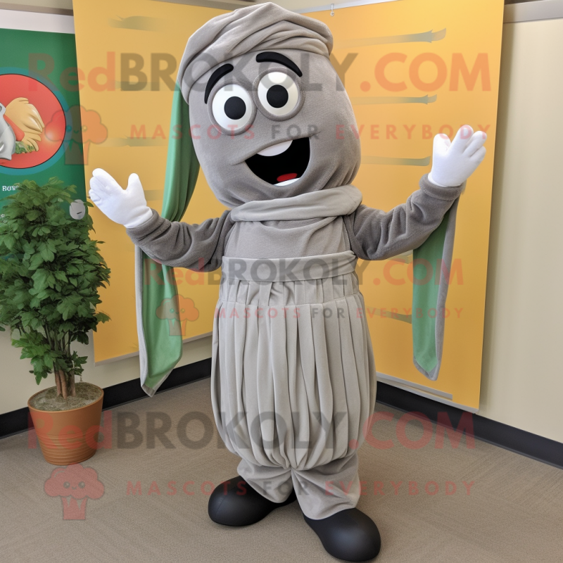 Gray Pesto Pasta mascot costume character dressed with a Corduroy Pants and Wraps