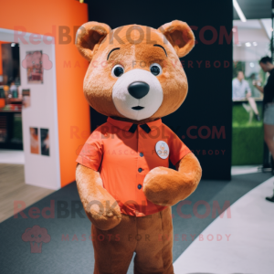 Orange Bear mascot costume character dressed with a Oxford Shirt and Lapel pins