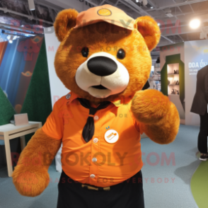 Orange Bear mascot costume character dressed with a Oxford Shirt and Lapel pins