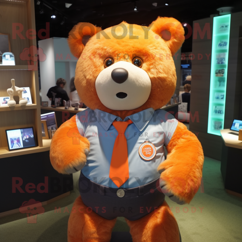 Orange Bear mascot costume character dressed with a Oxford Shirt and Lapel pins