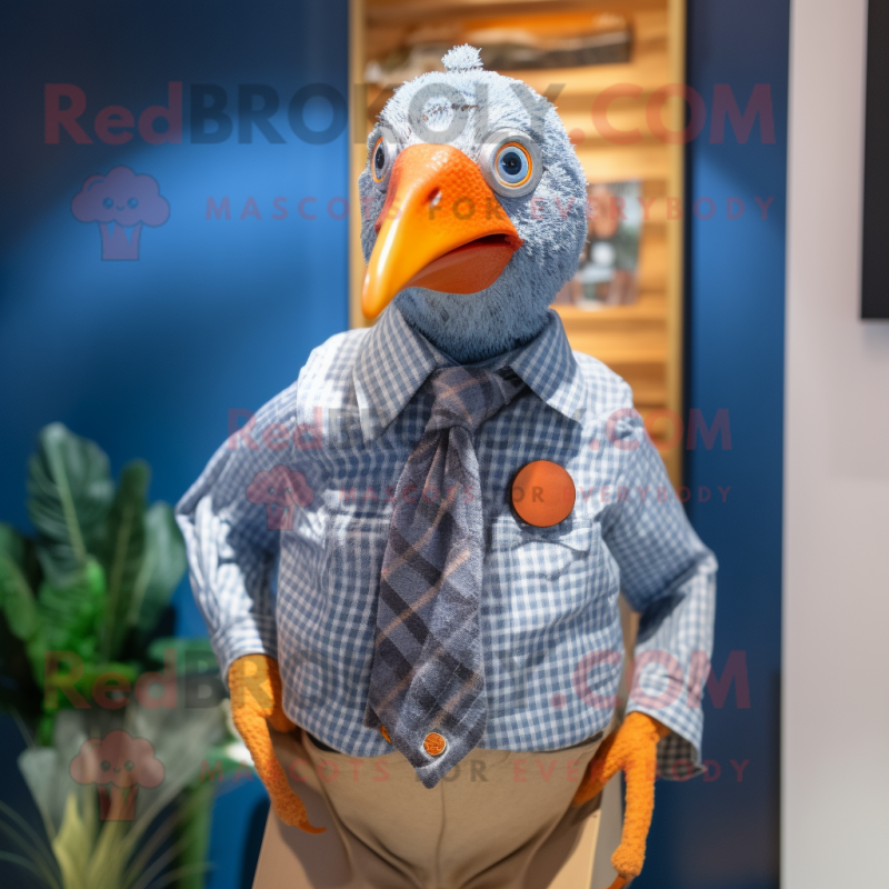 Orange Guinea Fowl mascot costume character dressed with a Chambray Shirt and Lapel pins