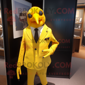 Lemon Yellow Blackbird mascot costume character dressed with a Suit Jacket and Tie pins