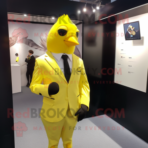 Lemon Yellow Blackbird mascot costume character dressed with a Suit Jacket and Tie pins