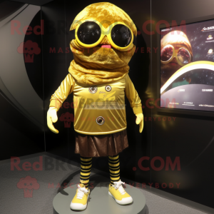 Gold Cyclops mascot costume character dressed with a Board Shorts and Scarf clips