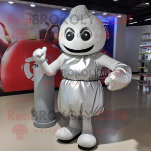 Silver Boxing Glove mascot costume character dressed with a Wrap Skirt and Backpacks